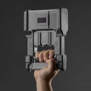 Grip Strength Dynamometer DEXDIA GX being held in a hand.