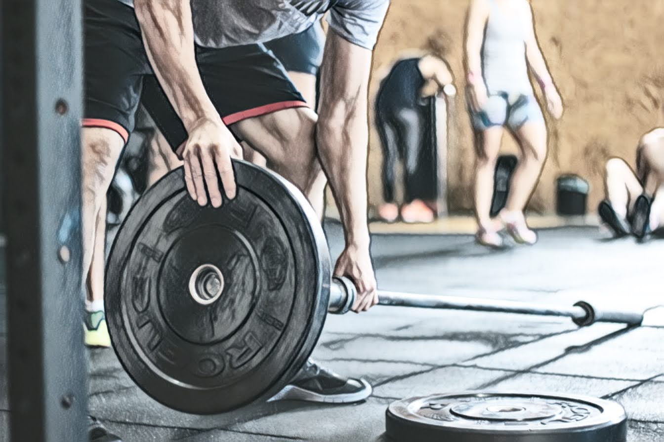 loading barbell in gym